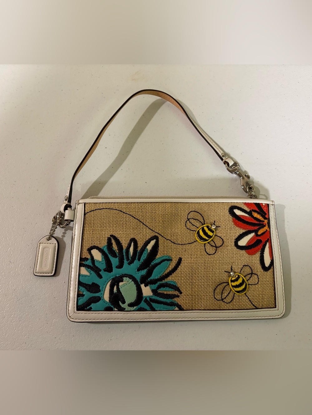 Coach Beige Canvas Wristlet with Turquoise Floral, Yellow Bees & Red Accents